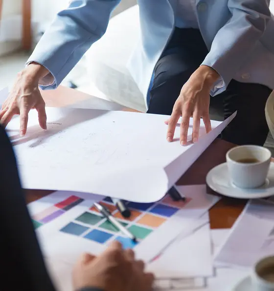 interior designer presenting blueprint 1